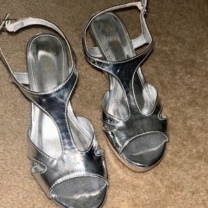 Brand new, shiny metallic, silver wedge, sandals, size  7.  3 inch wedge